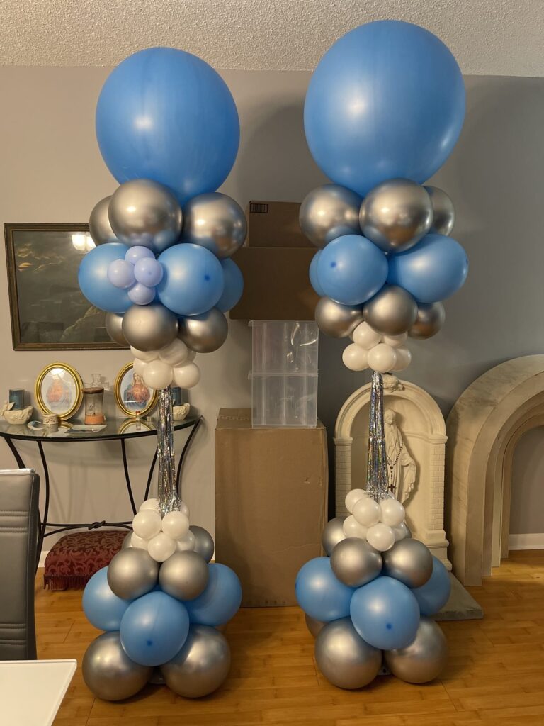 Pair of blue and chrome silver balloon columns with oversized orb toppers