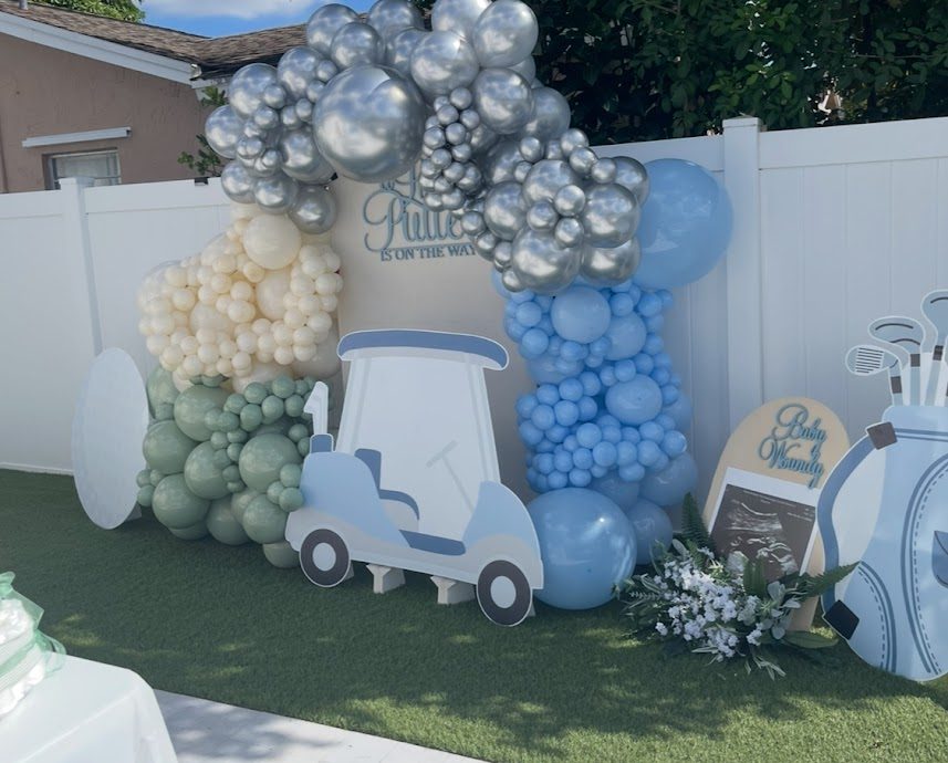 Golf themed baby shower display in powder blue, sage and chrome silver balloons