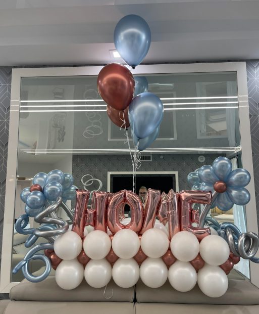 Rose gold HOME marquee letters on a balloon base with a coordinating helium bouquet