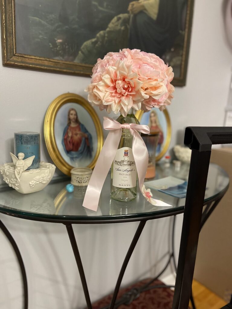 Peach floral bouquet tied with a pink ribbon
